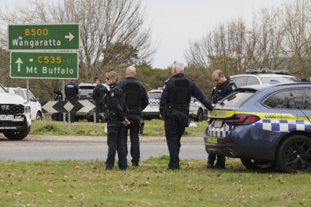 Australian police wait near the scene of a shooting in the state of Victoria, on Tuesday. Photo: AP