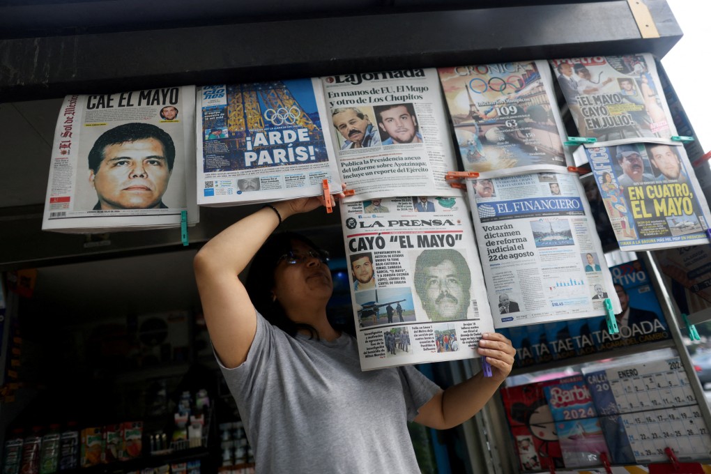 A newspaper seller arranges newspapers reporting the arrest of drug lord Ismael “El Mayo” Zambada in Mexico City in July 2024. Zambada on Monday pleaded guilty to drug-trafficking charges in the US. Photo: Reuters