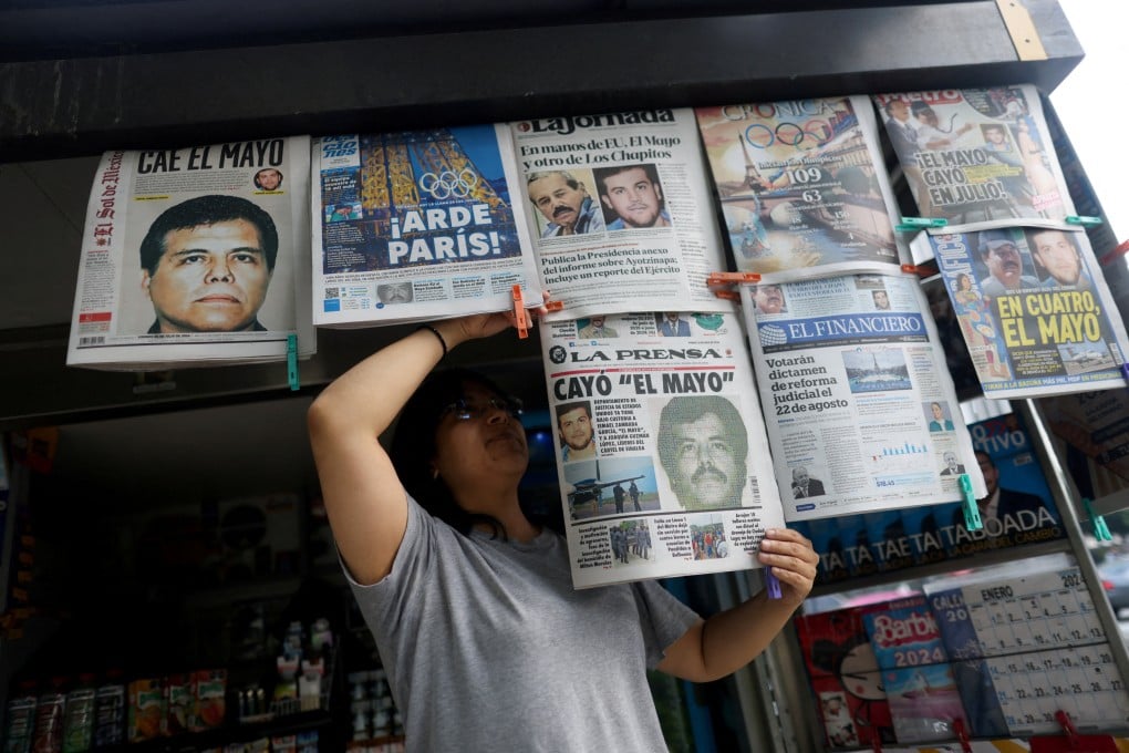 A newspaper seller arranges newspapers reporting the arrest of drug lord Ismael “El Mayo” Zambada in Mexico City in July 2024. Zambada on Monday pleaded guilty to drug-trafficking charges in the US. Photo: Reuters