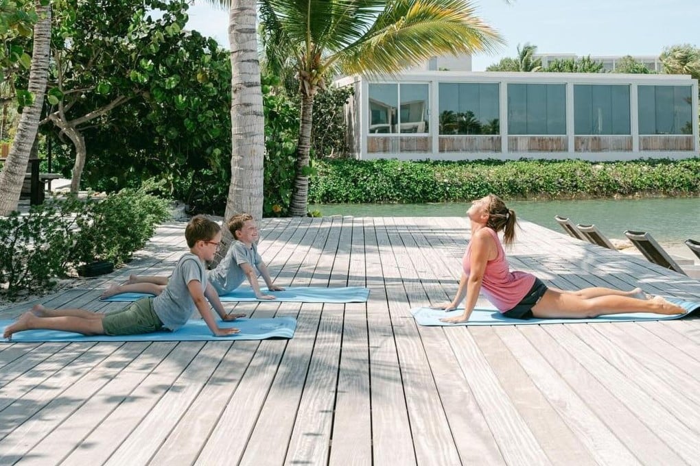 Children take part in a yoga class for kids at the South Bank luxury spa in Turks and Caicos, in the Caribbean. The spa is one of many to offer treatments for kids as well as their parents. Photo: South Bank