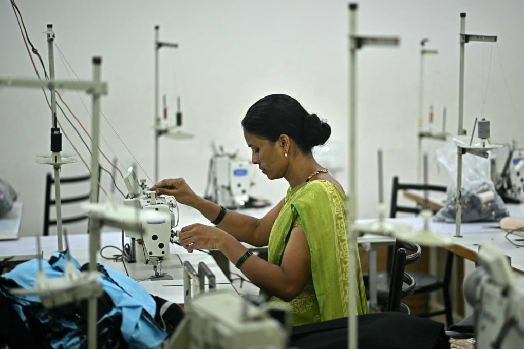 A garment worker uses a sewing machine at an apparel manufacturing unit in Bengaluru on August 25. Photo: AFP