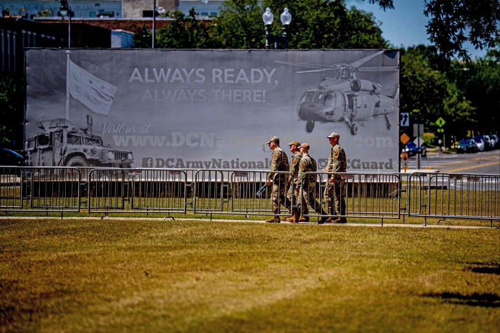 Soldier patrol outside the National Guard’s headquarters at the DC Armoury near the Washington Monument on Monday. Photo: Getty Images/AFP