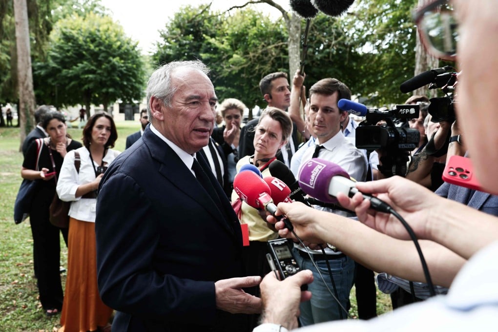 Frrench Prime Minister Francois Bayrou speaks to reporters in Boissy-la-Riviere on Tuesday. Photo: AFP