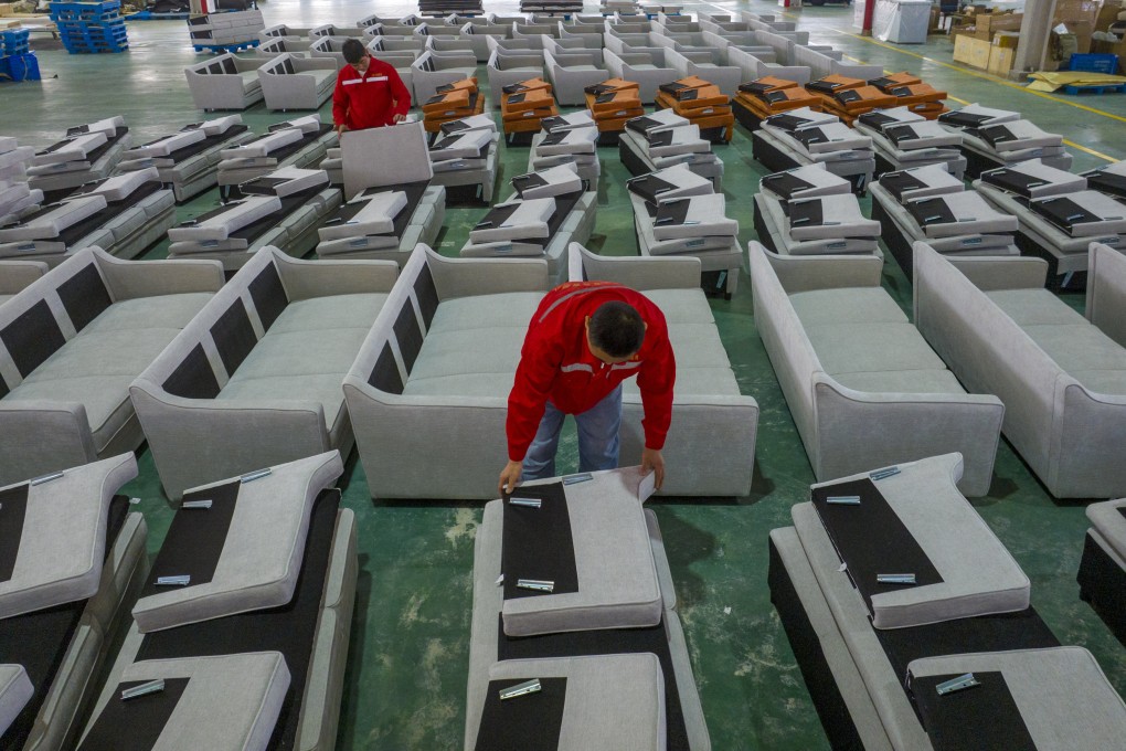 Workers produce sofas for sale to Europe and the United States at a furniture workshop in China’s Jiangsu province in December. Photo: Getty Images