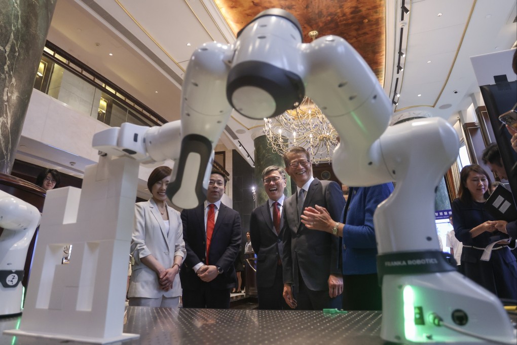 Robot technology is displayed at the inauguration ceremony for the Von Neumann Institute, established by the Hong Kong University of Science and Technology to drive AI innovation. The ceremony, held on May 9, was   attended by Financial Secretary Paul Chan Mo-po (fourth from left). Photo: Jonathan Wong