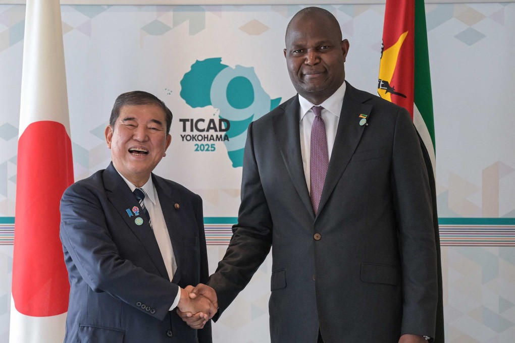 Japan’s Prime Minister Shigeru Ishiba shakes hands with Mozambique’s President Daniel Chapo on the sidelines of the Ninth Tokyo International Conference on African Development (TICAD 9) on Friday. Photo: AFP