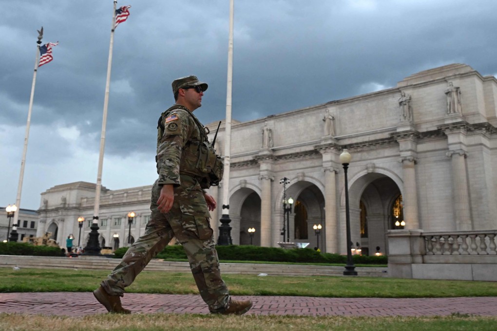 Members of the National Guard patrol outside Union Station as a storm approaches in Washington earlier this month. Photo: AFP