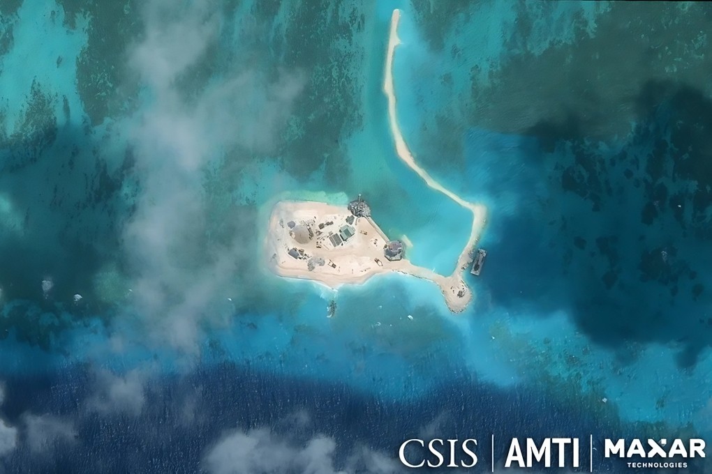 Satellite imagery taken this year shows Vietnamese dredging and landfill work at a reef in the Spratly Islands that had previously housed only small concrete pillbox structures. Photo: Maxar Technologies/CSIS/AMTI