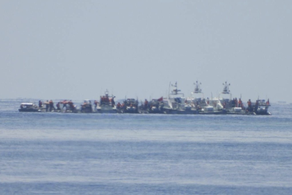 Chinese vessels, some mounted with armaments, are seen close to Philippine warship BRP Sierra Madre in the South China Sea on August 20. Photo: Armed Forces of the Philippines/AP