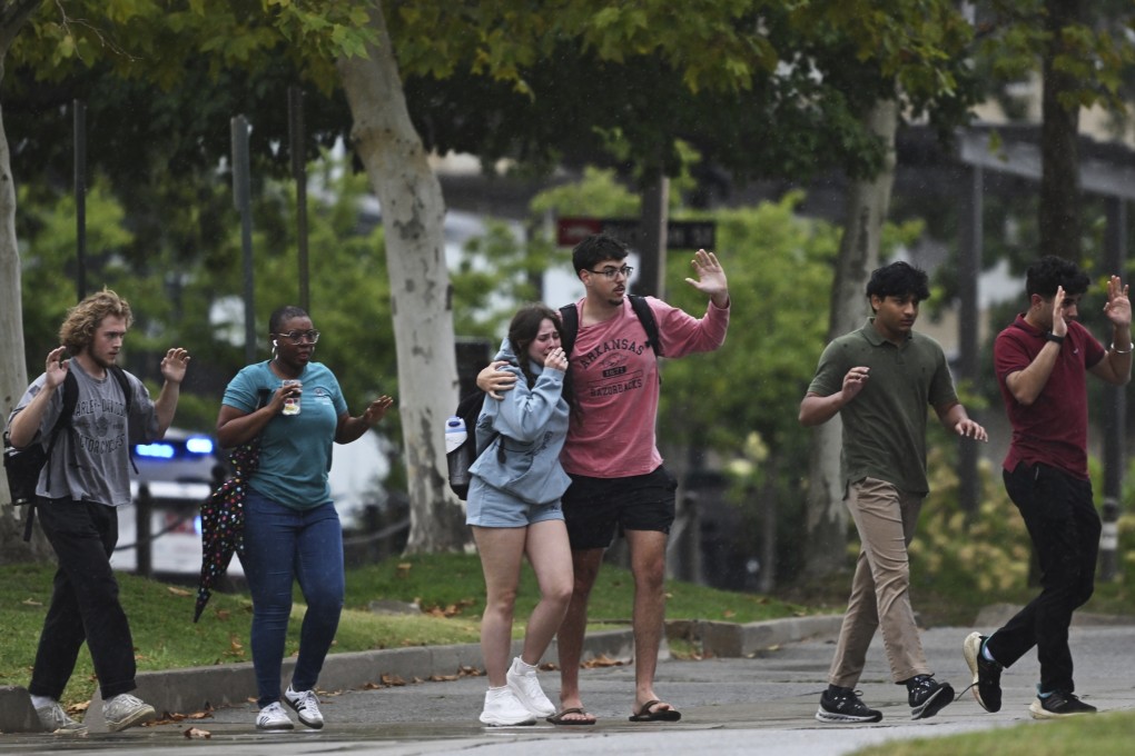 University of Arkansas students and employees on Monday as police respond to reports of a shooting. Photo: AP Photo