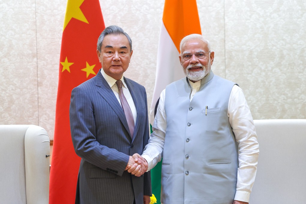 Indian Prime Minister Narendra Modi with Chinese Foreign Minister Wang Yi during their meeting in New Delhi on August 19. Modi is reportedly  expected to discuss with Chinese leaders in Tianjin later this month on issues ranging from trade to climate cooperation. Photo: EPA