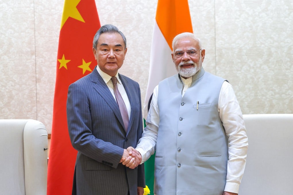 Indian Prime Minister Narendra Modi with Chinese Foreign Minister Wang Yi during their meeting in New Delhi on August 19. Modi is reportedly expected to discuss with Chinese leaders in Tianjin later this month on issues ranging from trade to climate cooperation. Photo: EPA