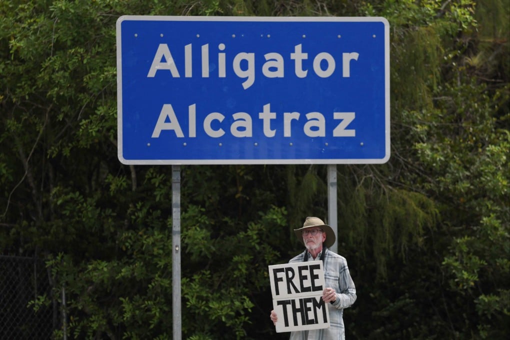 Activist Joshua Rubin protests at the entrance to “Alligator Alcatraz” on Friday. Photo: AFP