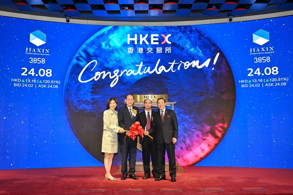 HKEX chairman Carlson Tong (right) and CEO Bonnie Chan with executives of Jiaxin International Resources Investment at the trading debut of the company’s shares in Hong Kong on Thursday. Photo: Handout