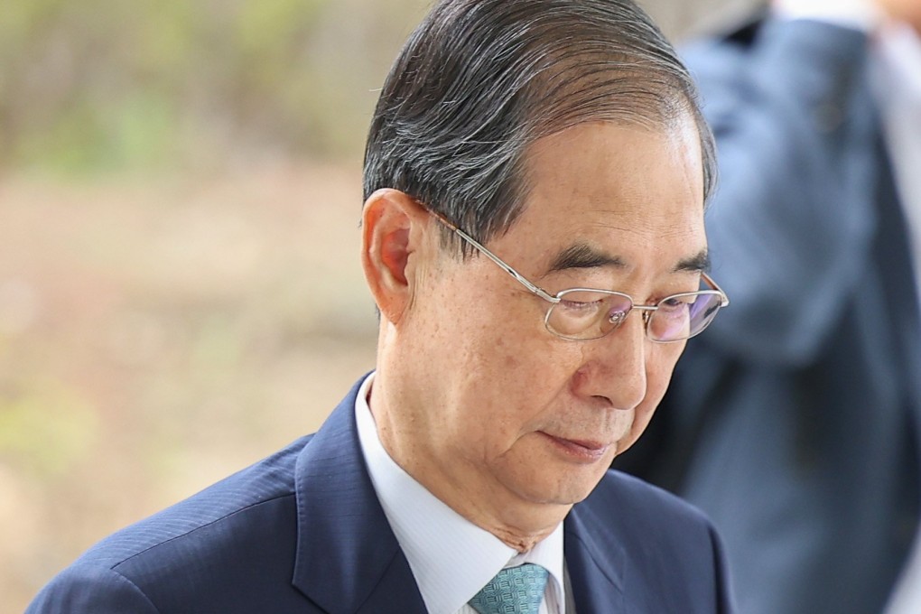 South Korea’s former prime minister Han Duck-soo appears at the Seoul High Prosecutors Office for questioning on Friday.  Photo: Yonhap/EPA