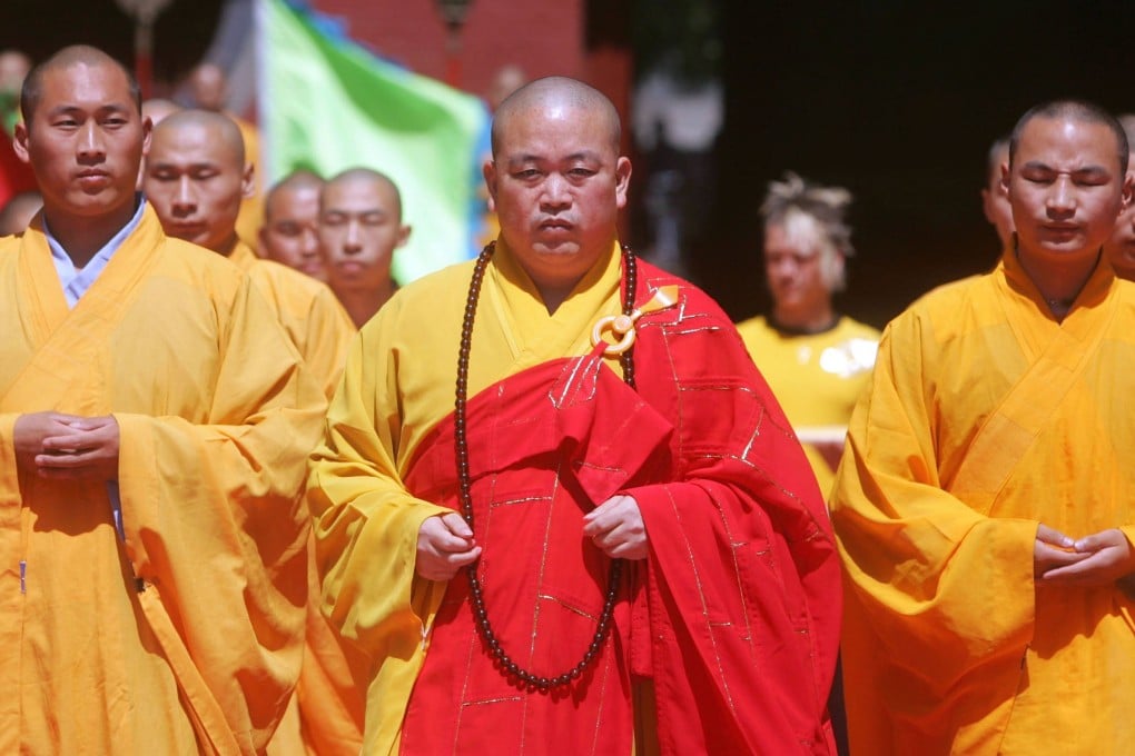 Shi Yongxin (pictured here in 2006), the former abbot of China’s Shaolin Temple, is facing an official investigation for financial and sexual misconduct. China Photos: Getty Images