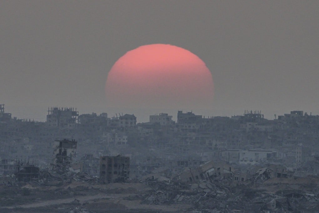 The sun sets behind buildings destroyed during Israeli ground and air operations in the Gaza Strip on Tuesday. Photo: AP