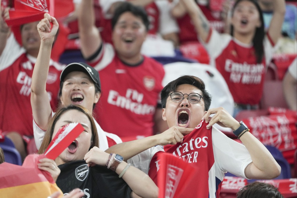Fans watch the match between Arsenal and Tottenham Hotspur during the Hong Kong Football Festival at Kai Tak Sports Park on July 31. Photo: Sam Tsang