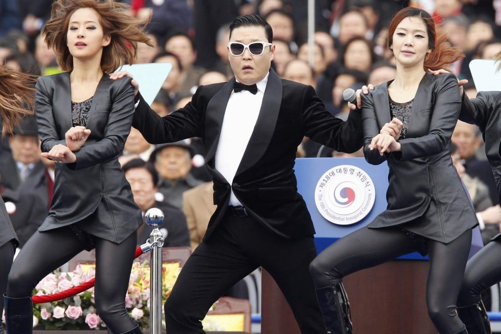 Psy (centre) performs at South Korea’s parliament in Seoul in February 2013. Photo: Reuters