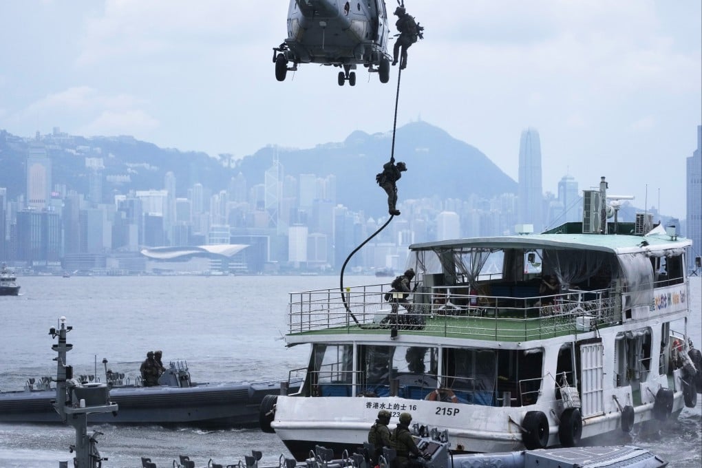 A highlight of the exercise involved officers abseiling from helicopters onto a “hijacked” water taxi. Photo: Karma Lo