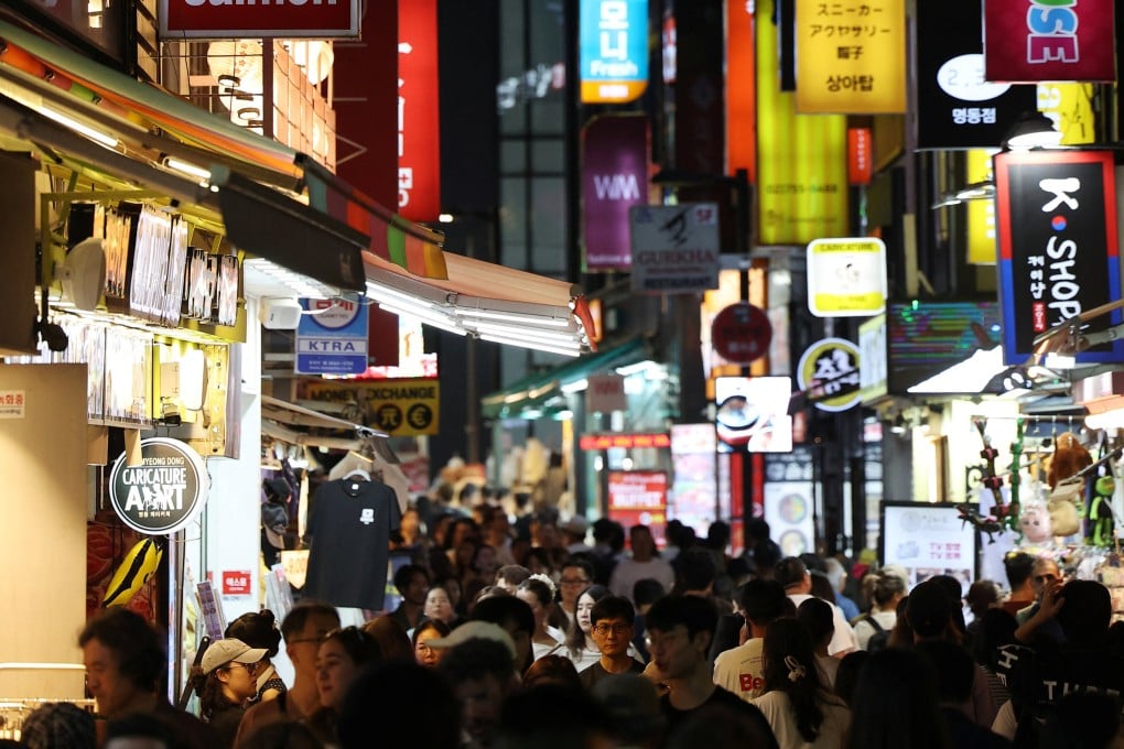 People walk through a crowded street in the Myeong-dong shopping district of Seoul on August 5. Photo: Reuters