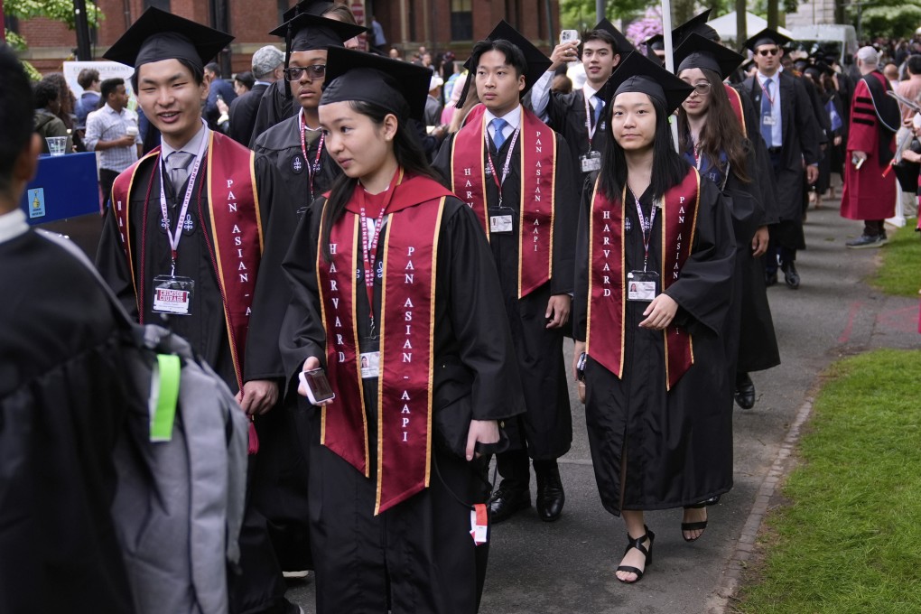 Students proceed through Harvard Yard during commencement ceremonies at Harvard University in May. Photo: AP