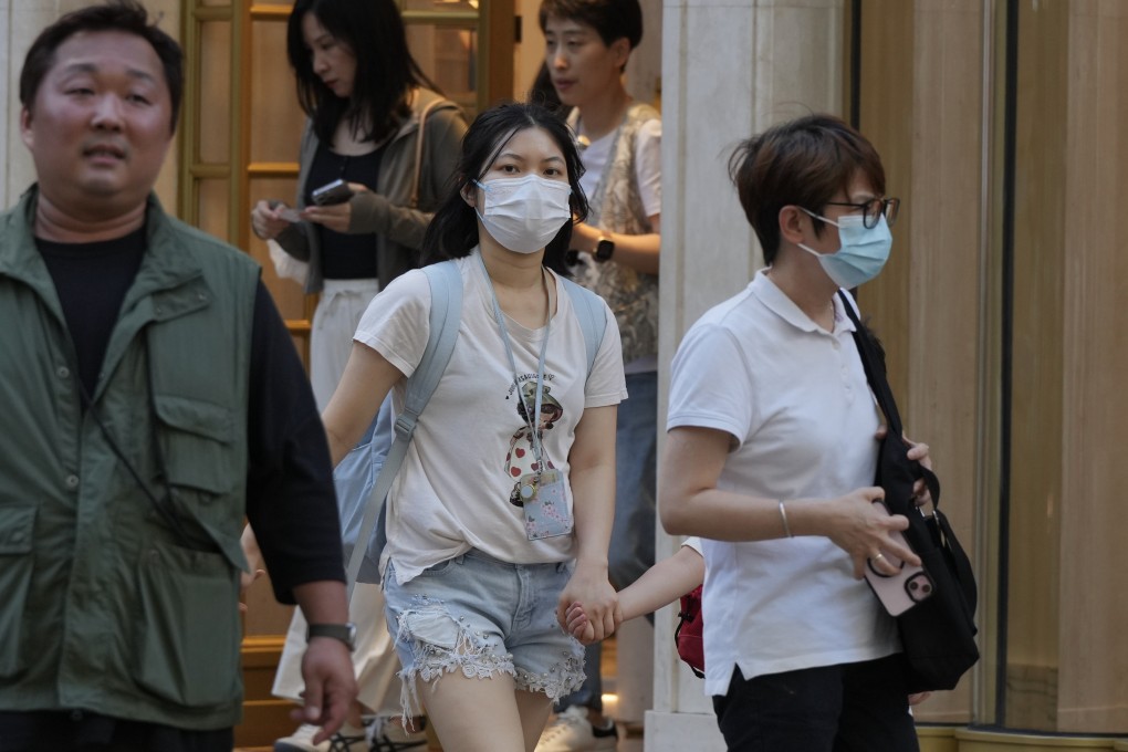 People wearing masks for protection in Tsim Sha Tsui on May 15 after the city’s health authorities announced they had recorded 30 Covid-19-related deaths among 81 severe adult cases in four weeks. Photo: May Tse