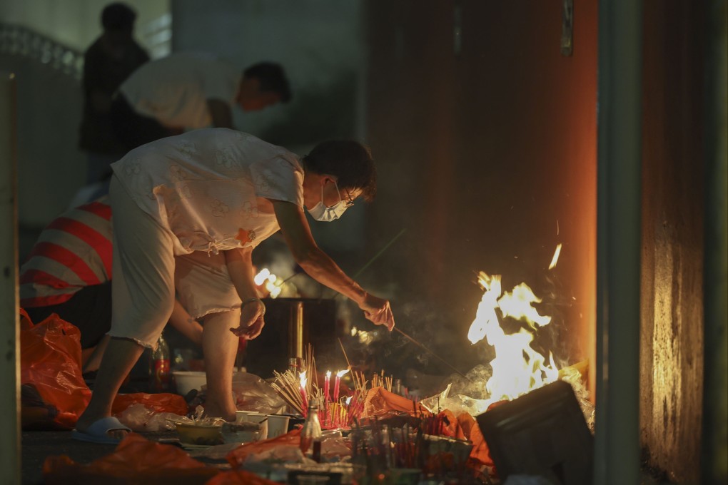 People burn joss money and offerings in Hong Kong during the 2024 Hungry Ghost Festival. Photo: Edmond So