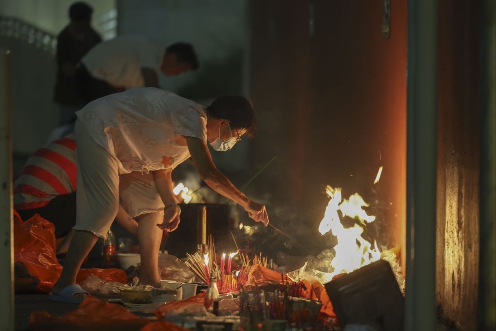 People burn joss money and offerings in Hong Kong during the 2024 Hungry Ghost Festival. Photo: Edmond So
