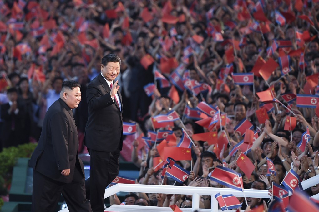 Chinese President Xi Jinping and North Korean leader Kim Jong-un wave to a crowd in Pyongyang in June 2019 – the last time the two leaders met in person. Photo: Xinhua