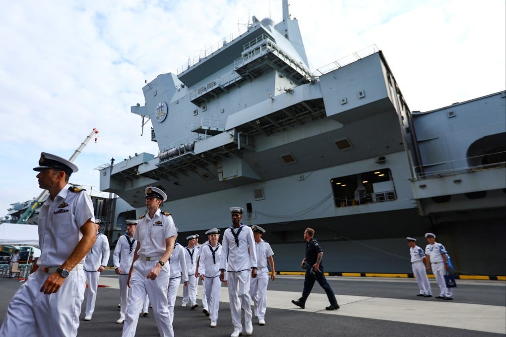 Royal Navy sailors disembark from Britain’s HMS Prince of Wales aircraft carrier upon arrival in Tokyo on Thursday. Photo: Reuters