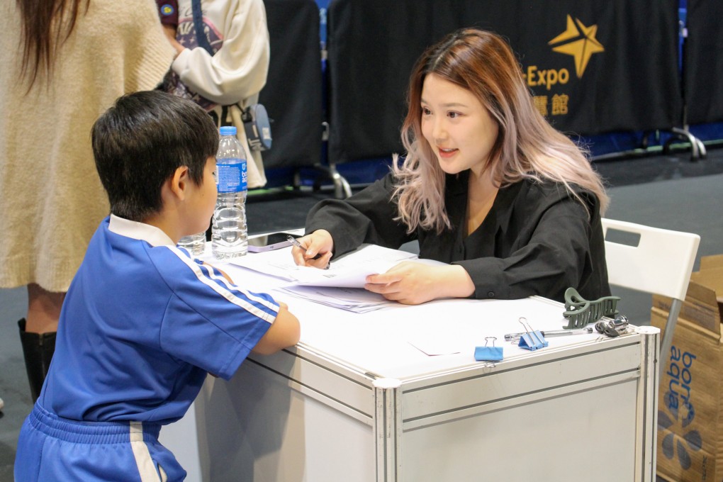 A cihld from Shenzhen is evaluated by the representaitve of an educational institution in Hong Kong in December 2023. Photo: Jack Deng