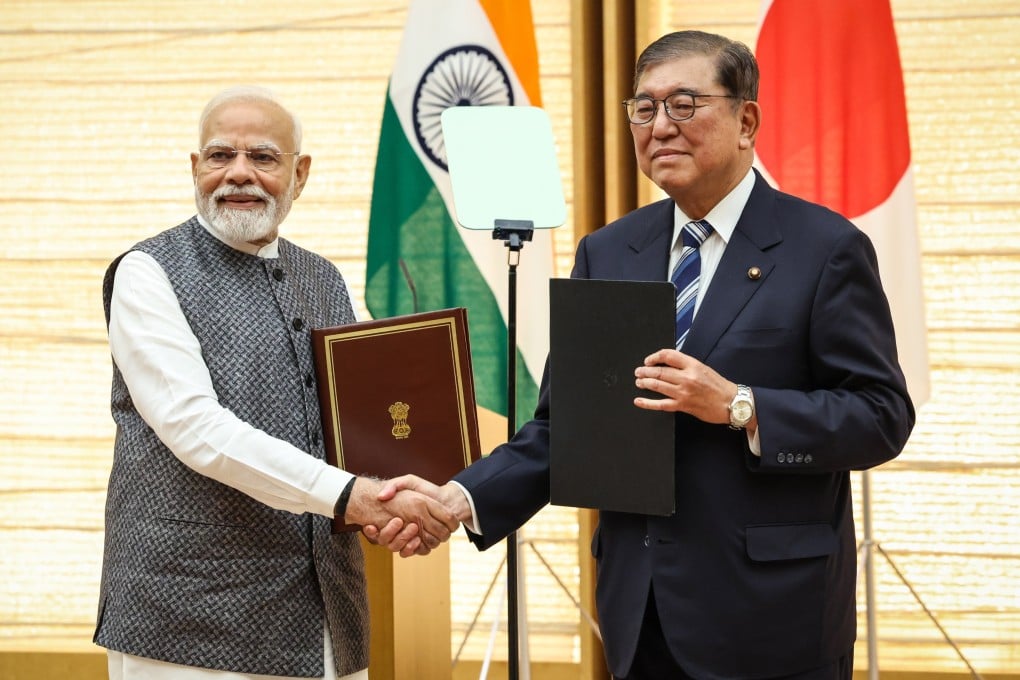India’s Prime Minister Narendra Modi (left) and Japan’s Prime Minister Shigeru Ishiba shake hands during a joint press conference in Tokyo on Friday. Photo: EPA