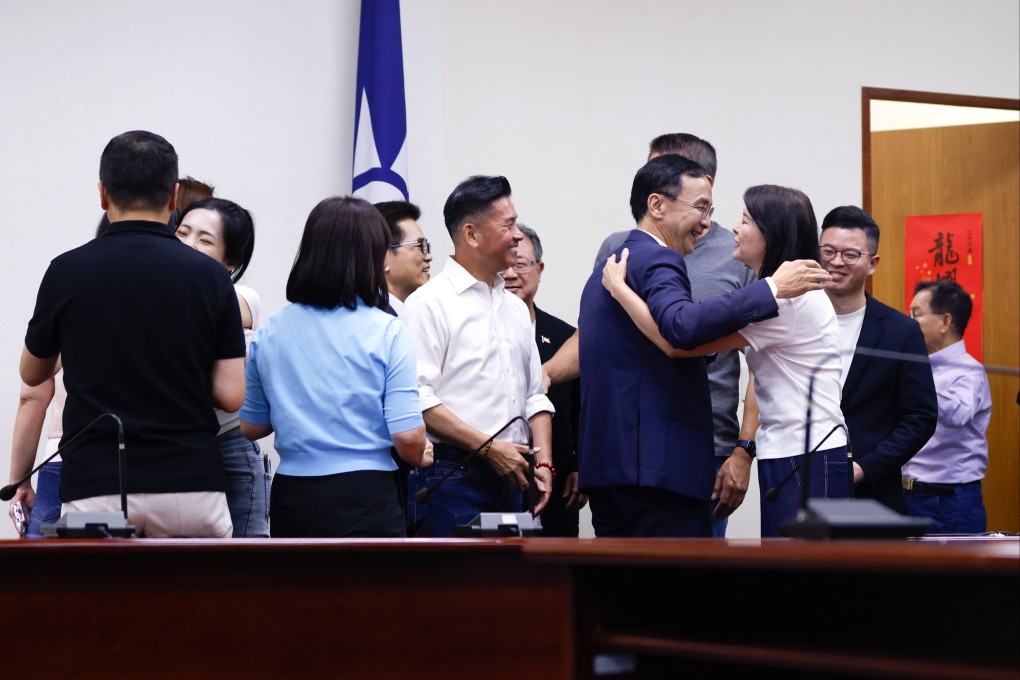 Kuomintang chairman Eric Chu Li-luan (centre right) with KMT lawmakers on July 26 after they retained their seats in the first mass recall vote. Photo: EPA