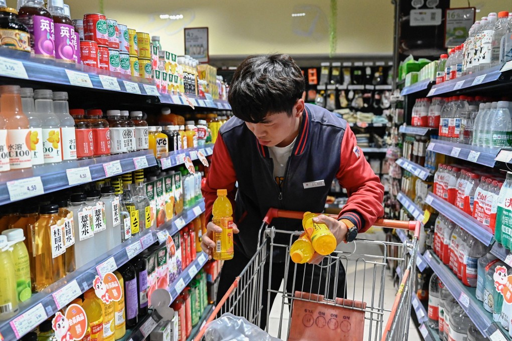 An employee sorts products at a supermarket in Beijing on April 15. China is promoting voluntary front-of-pack nutrition labelling, a sign of growing regulatory momentum to match rising health awareness. Photo: AFP