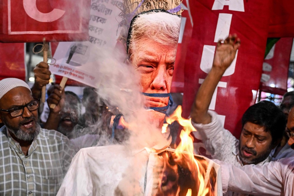 Indian activists burn an effigy of US President Donald Trump earlier this month to protest against tariff increases. Photo: AFP