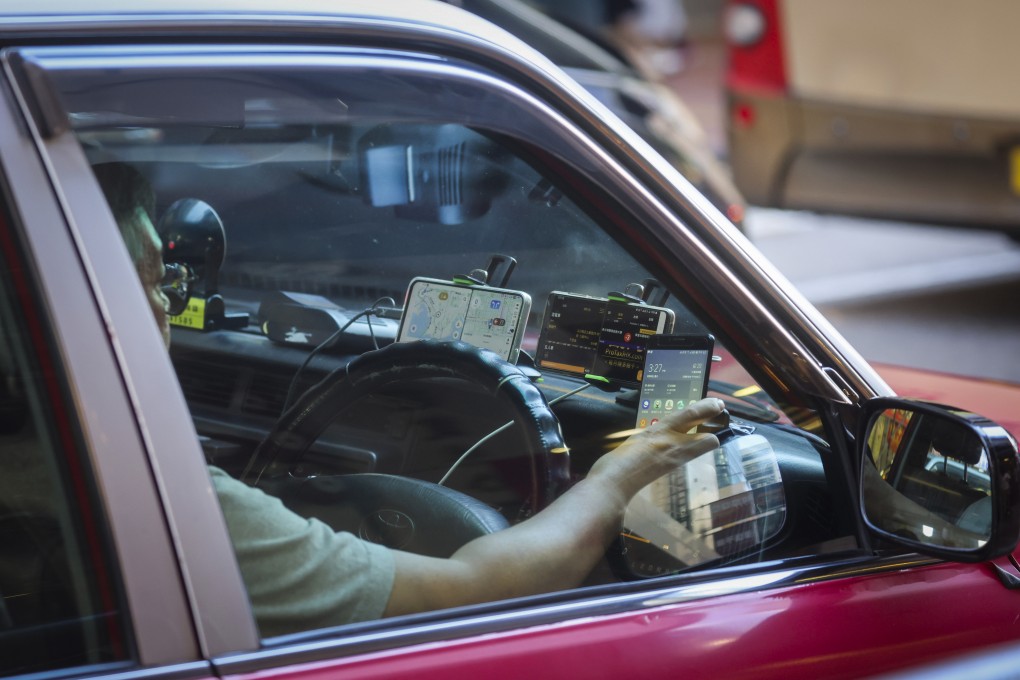 Hong Kong drivers will be banned from placing more than two phones on their vehicle dashboards starting January next year. Photo: Edmond So