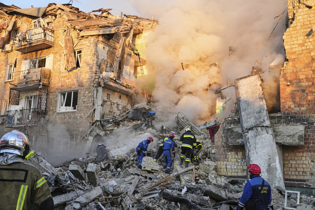 Firefighters work on the site of a burning building after a Russian attack in Kyiv, Ukraine, on Thursday. Photo: AP