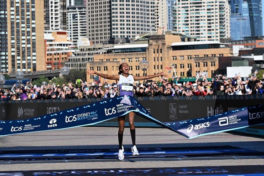 Netherlands’s Sifan Hassan celebrates as she crosses the finish line in the 2025 Sydney Marathon. Photo: AFP