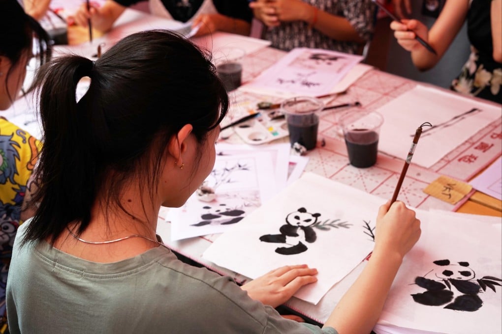 A Vietnamese student works on a Chinese painting during an event celebrating the 14th annual United Nations Chinese Language Day at Hanoi University in Vietnam in, 2023. Photo: Xinhua