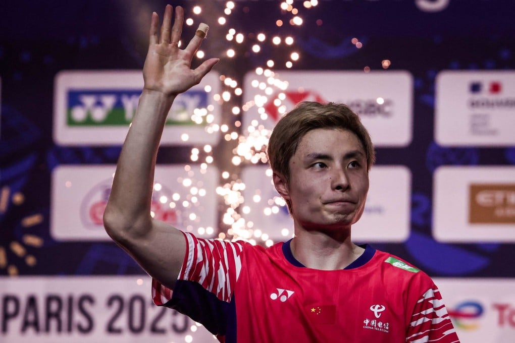 Gold medallist China’s Shi Yuqi celebrates on the podium after winning the World Badminton Championships singles final match against Thailand’s Kunlavut Vitidsarn. Photo: AFP