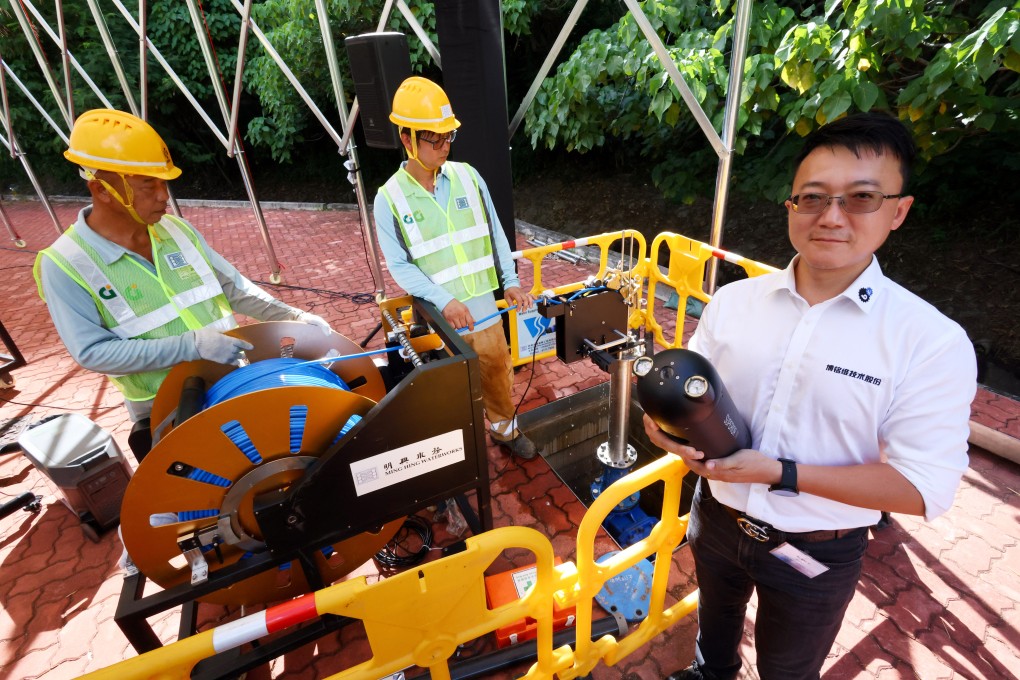 Shenzhen Bwell Technology president Dai Yi demonstrates the capabilities of some equipment. Photo: Dickson Lee