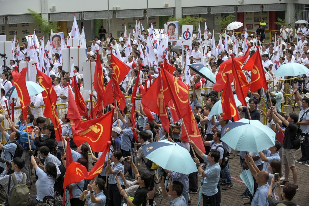 Supporters of the opposition Workers Party and the ruling People’s Action Party show support for their political party at a nomination centre in Singapore on April 23. Photo: EPA-EFE