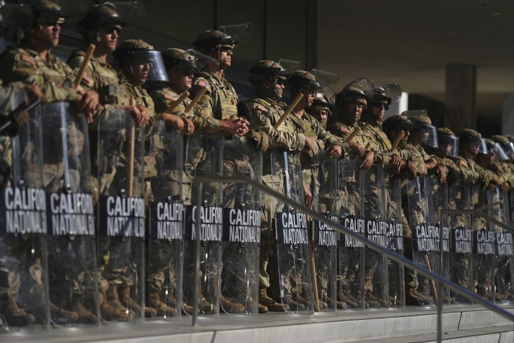 California National Guard members are positioned at the Federal Building in downtown Los Angeles in June. Photo: AP