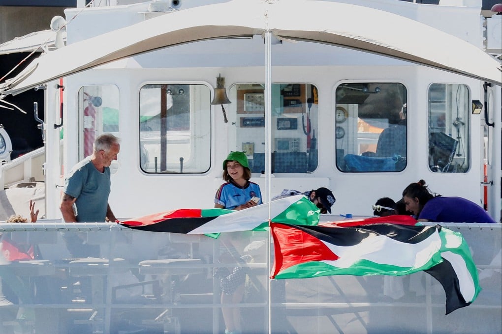 Swedish activist Greta Thunberg and other flotilla members wait on their boat. Photo: Reuters