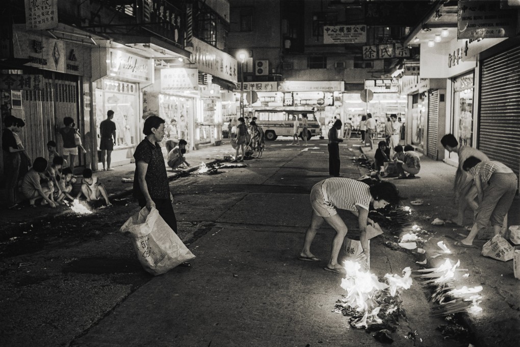 People burning paper offerings and incense on the street to appease the spirits during the Hungry Ghosts Festival in Hong Kong, in 1986. Photo: SCMP Archives