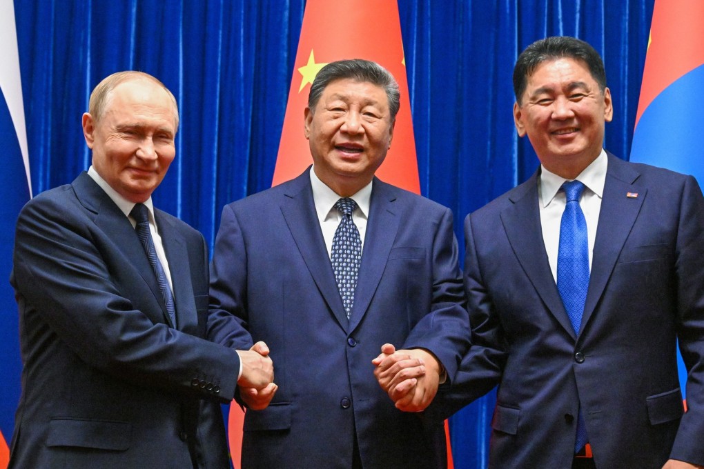 Chinese President Xi Jinping with his Russian and Mongolian counterparts ahead of their meeting at the Great Hall of the People in Beijing. Photo: Kremlin/dpa