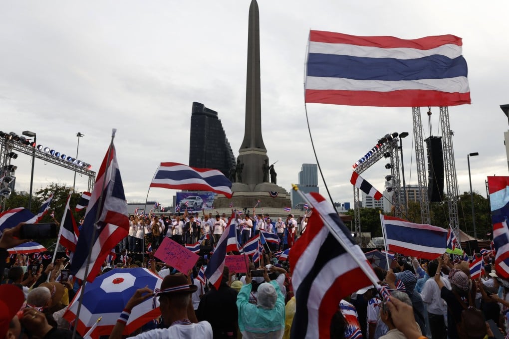 Demonstrators wave Thai national flags during a protest at Victory Monument in Bangkok, Thailand on August 31. Photo: EPA
