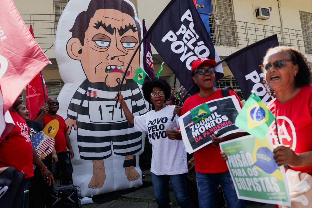 An inflatable figure depicting Brazil’s former president Jair Bolsonaro is seen near protesters during a demonstration in Sao Paulo, Brazil, on Tuesday. Photo: Reuters