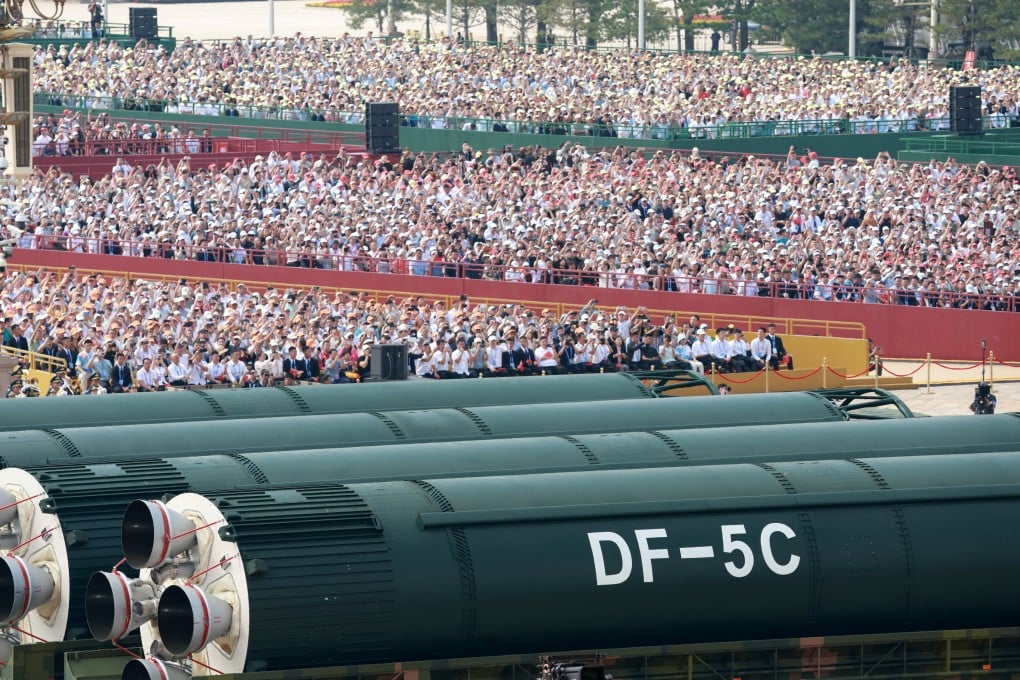 Spectators watch as DF-5C intercontinental strategic nuclear missiles are showcased at a military parade to mark the 80th anniversary of the end of World War Two in Beijing on Wednesday. Photo: China Daily via Reuters